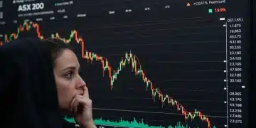 ASX 200 stock market chart showing a significant 4% decline in Q2 2026, with red downward arrows and a concerned investor's hand hovering over a keyboard.